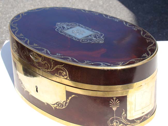 A Fabulous Antique French brass inlaid oval mahogany Dressing Box circa circa 1810.